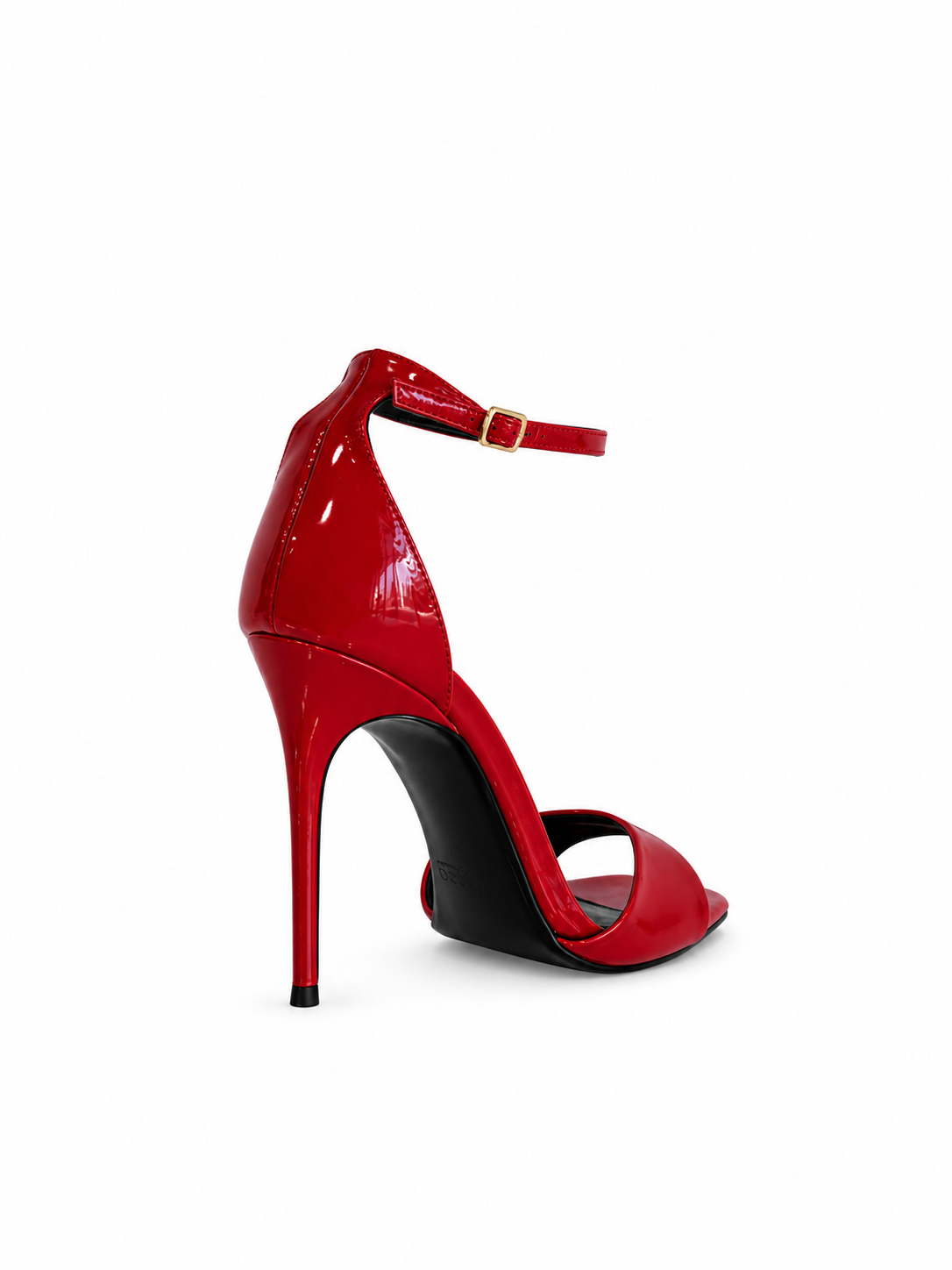 Red patent leather heeled sandal with open toe, thin heel, and ankle strap buckle