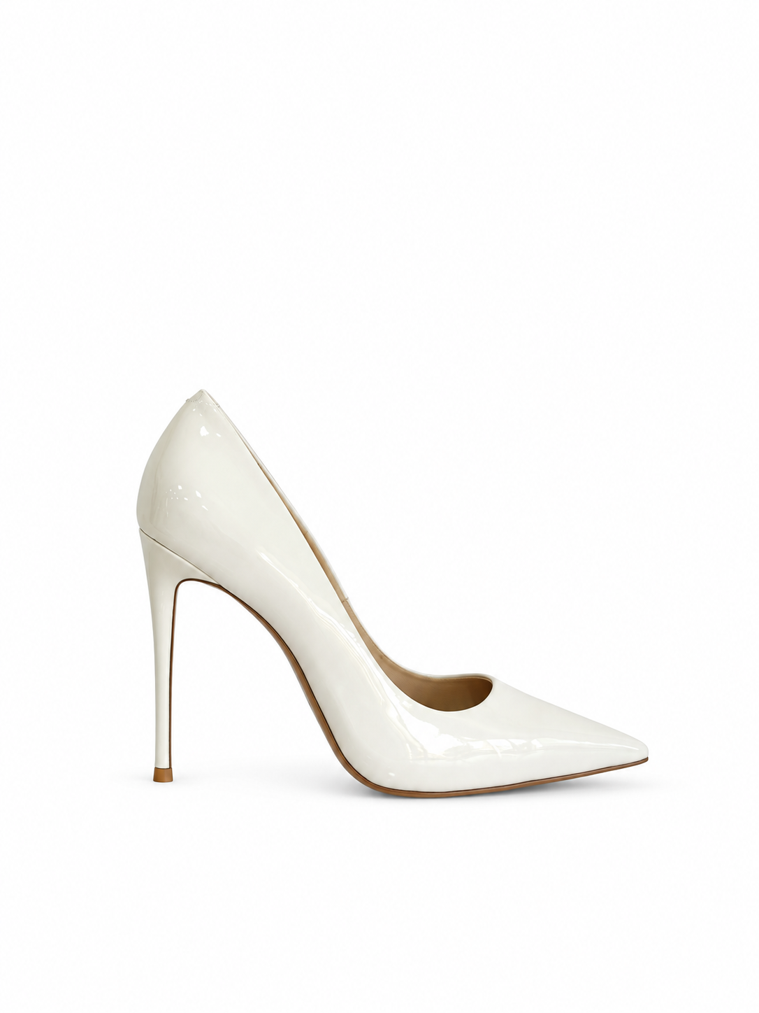 White patent leather pointed-toe pumps, front angled view, stiletto heel