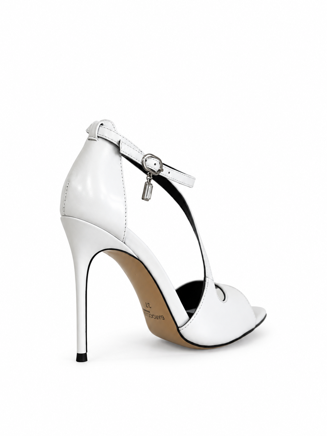 White leather heeled sandals, T-strap with metal buckle and stiletto heel.