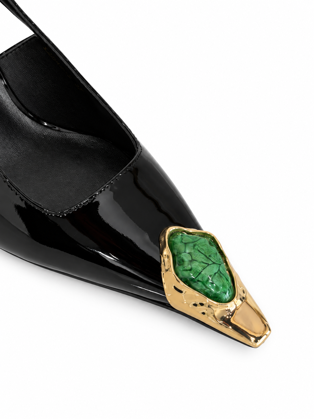 Black patent leather slingback pump with pointed toe and green gem gold ornament