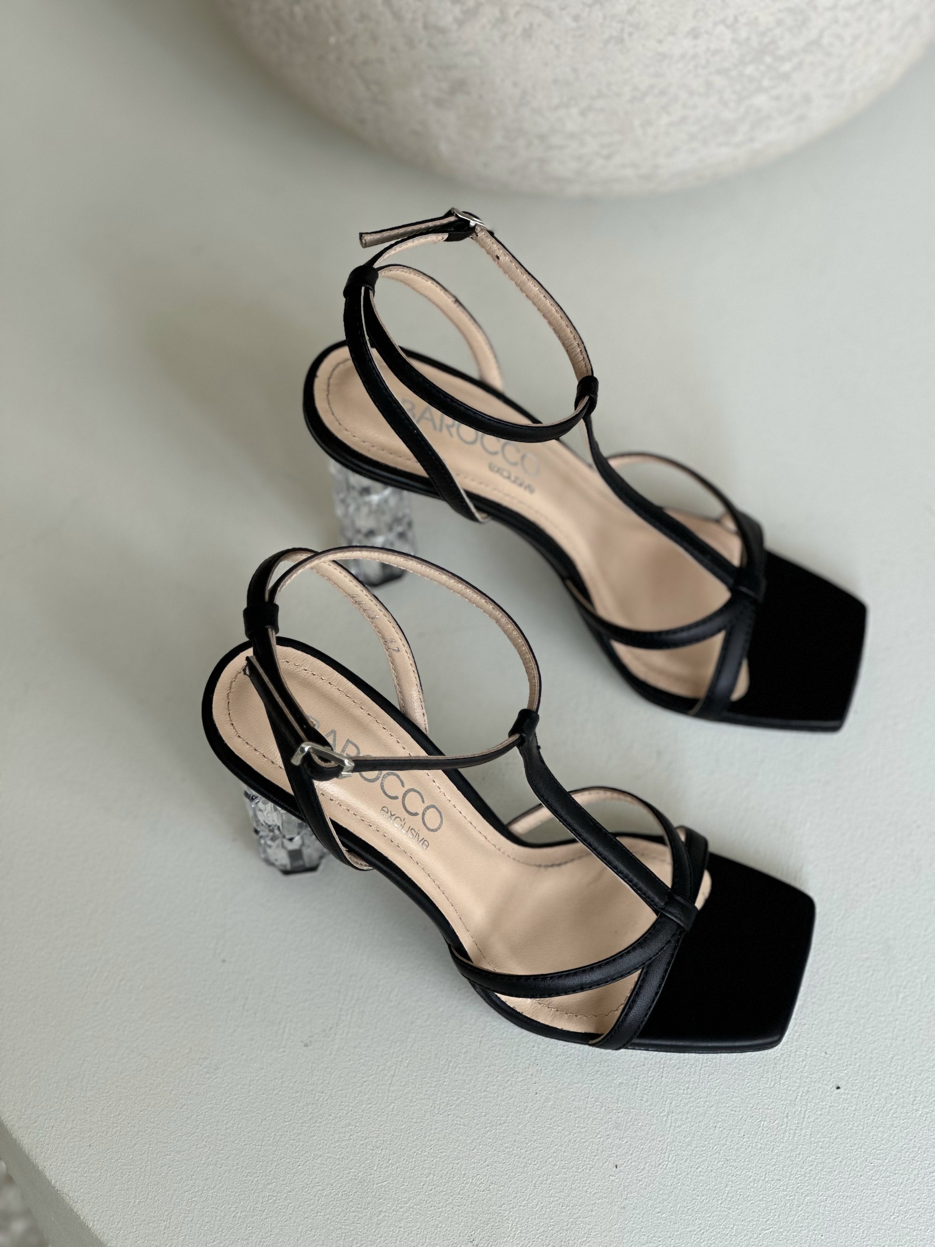 Black strappy sandals with square toe and clear block heels, elegant women's footwear